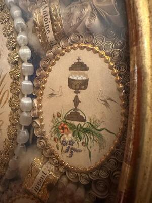 Multi Reliquary / Monastery - Work en Oval Wooden Frame / Glass / Multiple fully hand - made ornaments / Gold Leaf Papier - Rolle / Hand Painted depictions, France 19 th century ( Anno 1860 )